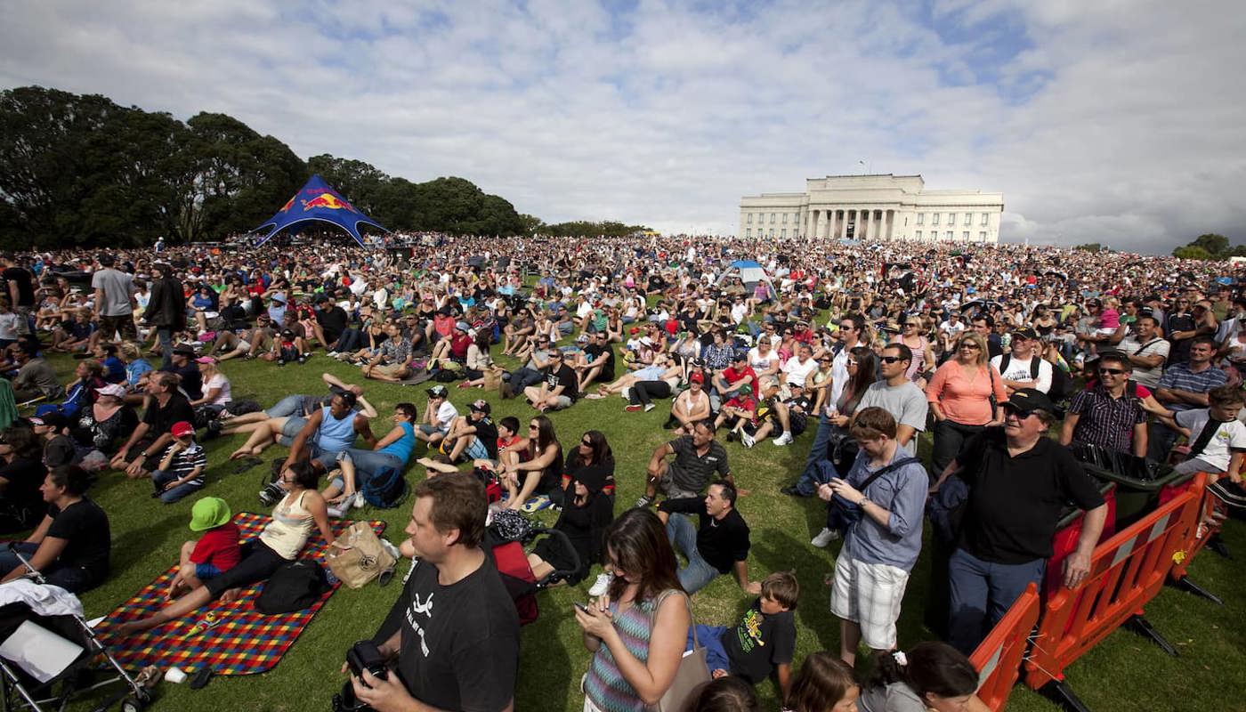 The crowd's packed for the trolley racing to begin at the Auckland Domain