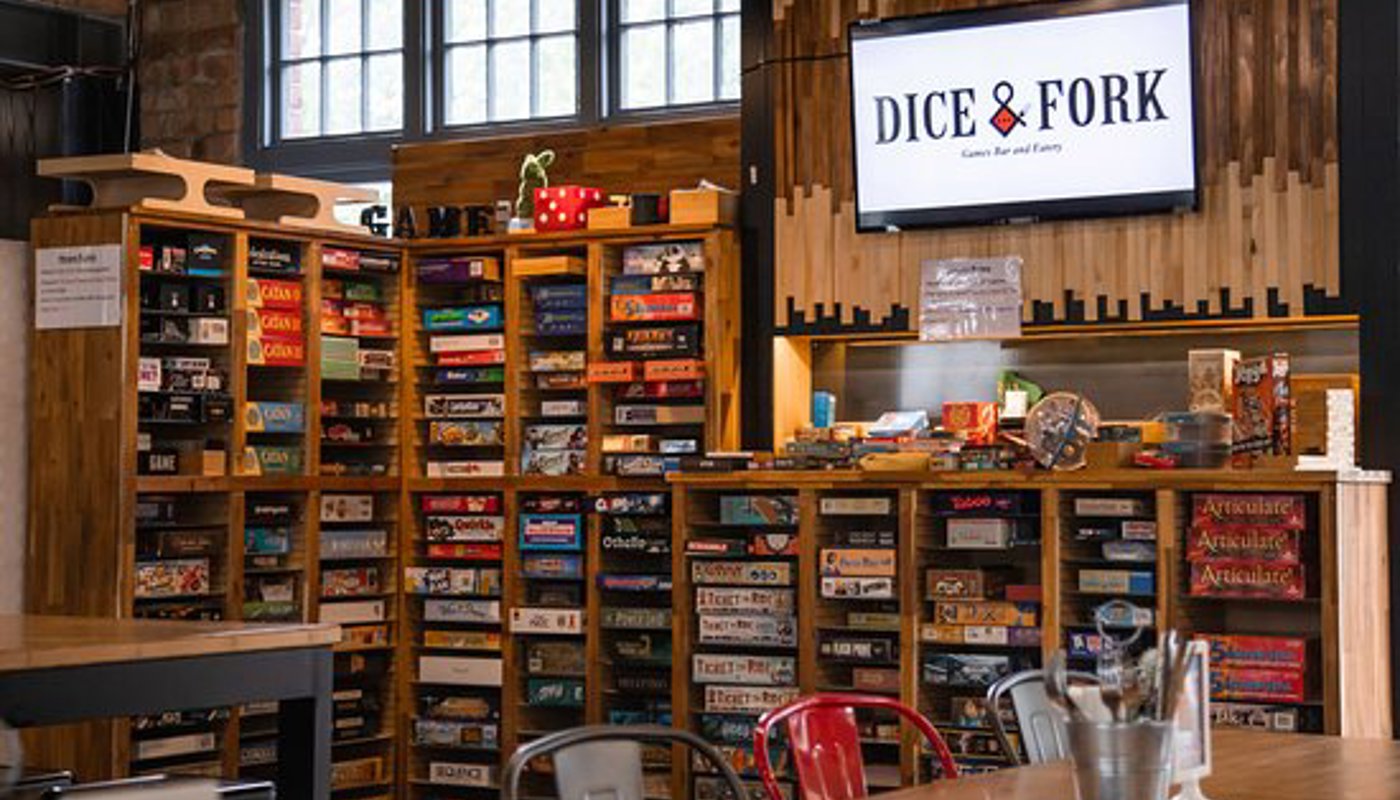 The boardgame wall at Dice & Fork in Auckland