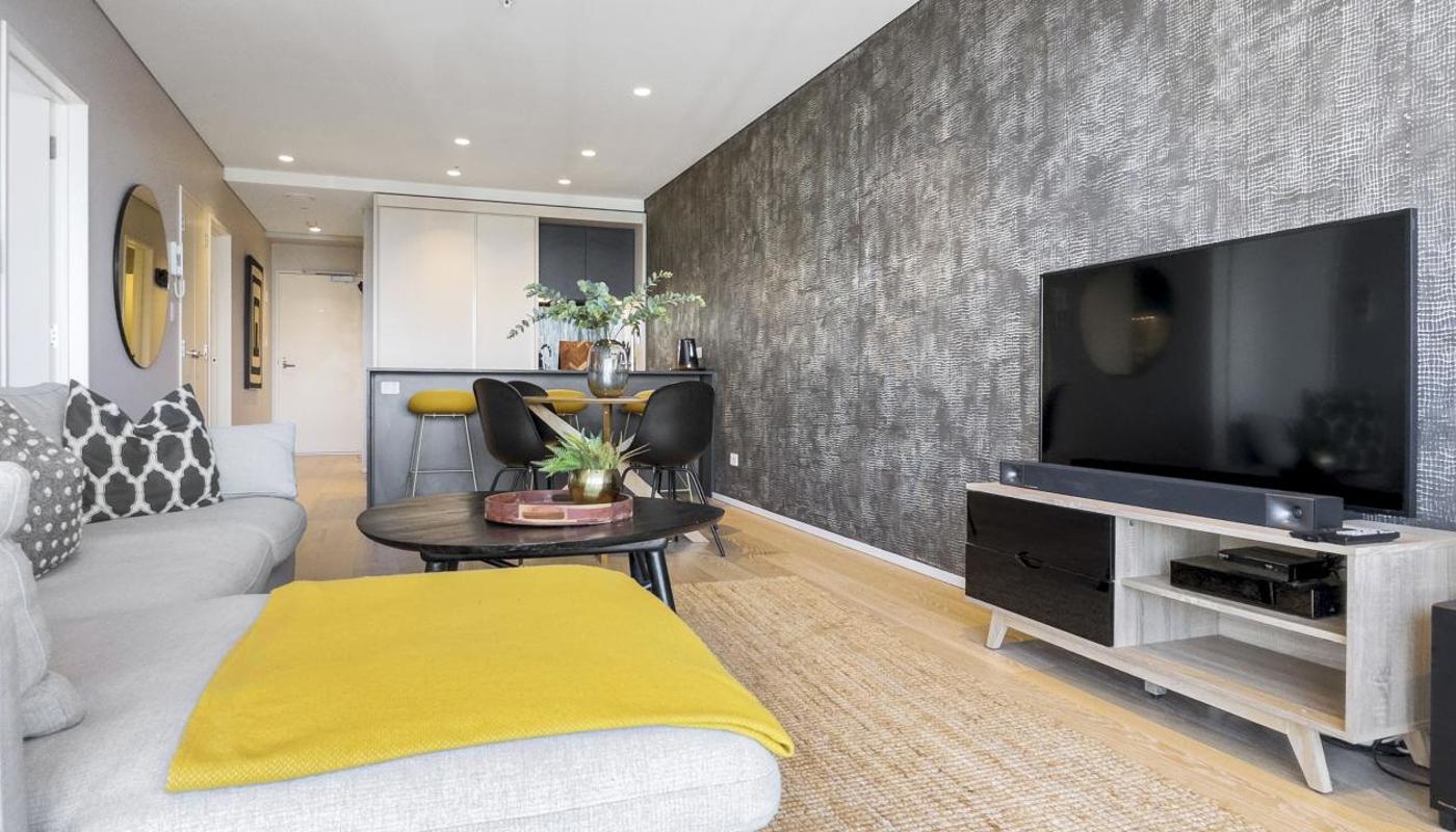 OPen plan living area flows through to the dining and kitchen area