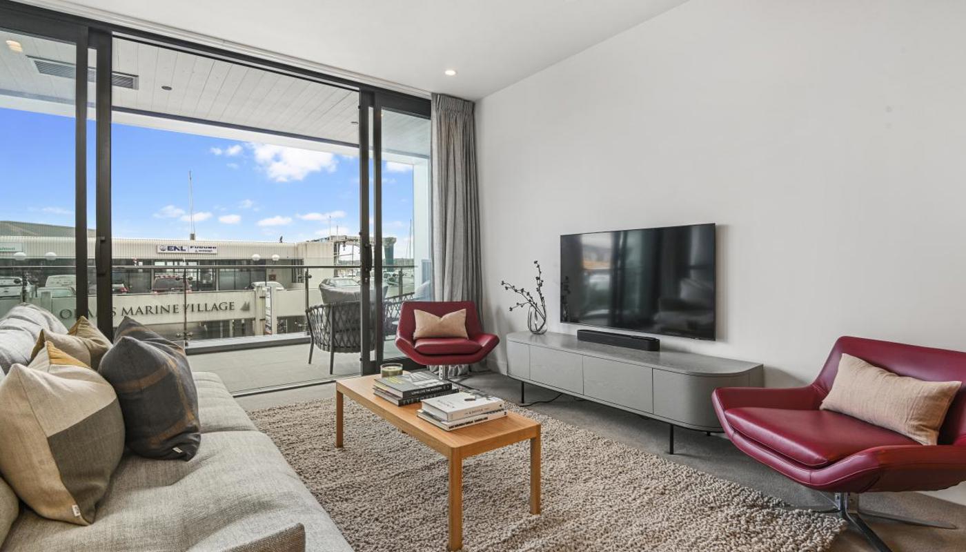 Living room flows through to the covered balcony.