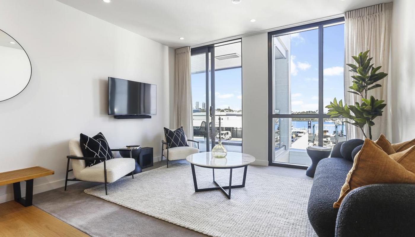Stylish living area flows out to the covered balcony