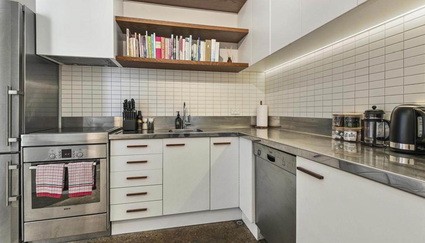 Kitchen comes equipped with cooking essentials.