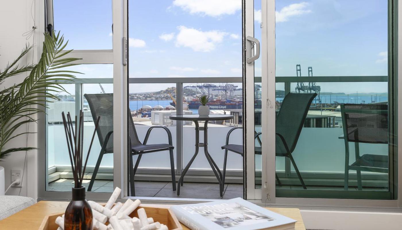 Detail shot looking through to lovely outdoor sitting arrangement to take in the harbour view.