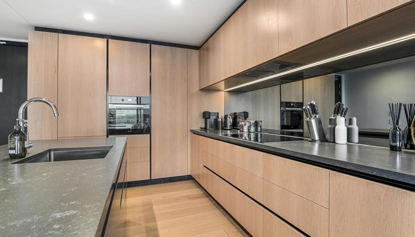 Spacious kitchen comes equipped with modern appliances.
