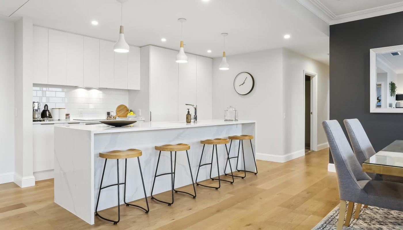 Spacious kitchen area equipped with modern appliances and cooking essentials