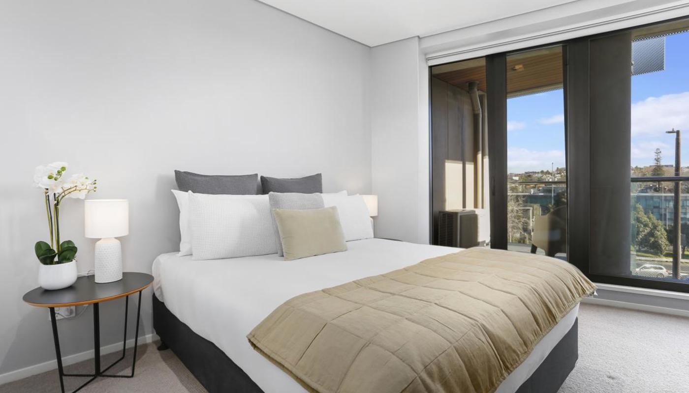 Master bedroom includes balcony access