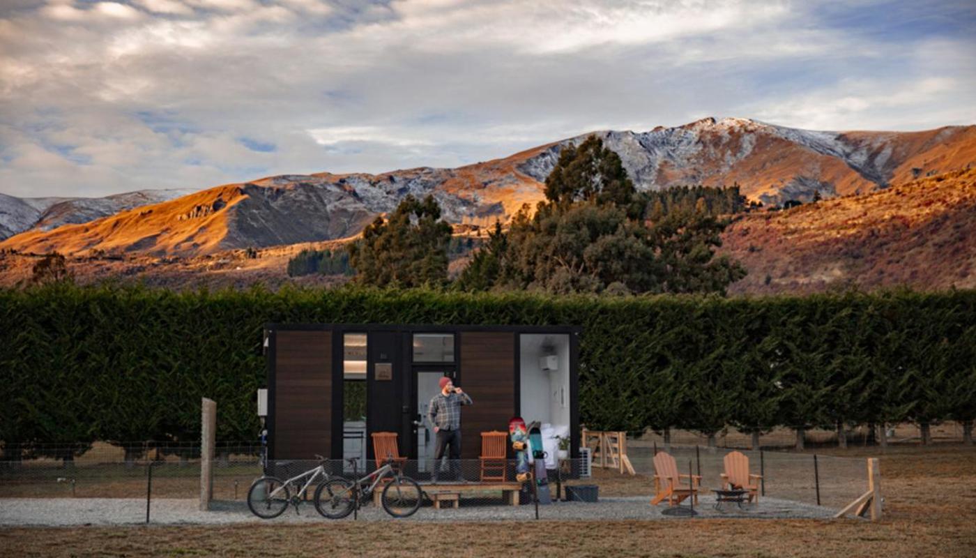 Tranquility in our charming tiny house, set against a stunning backdrop.