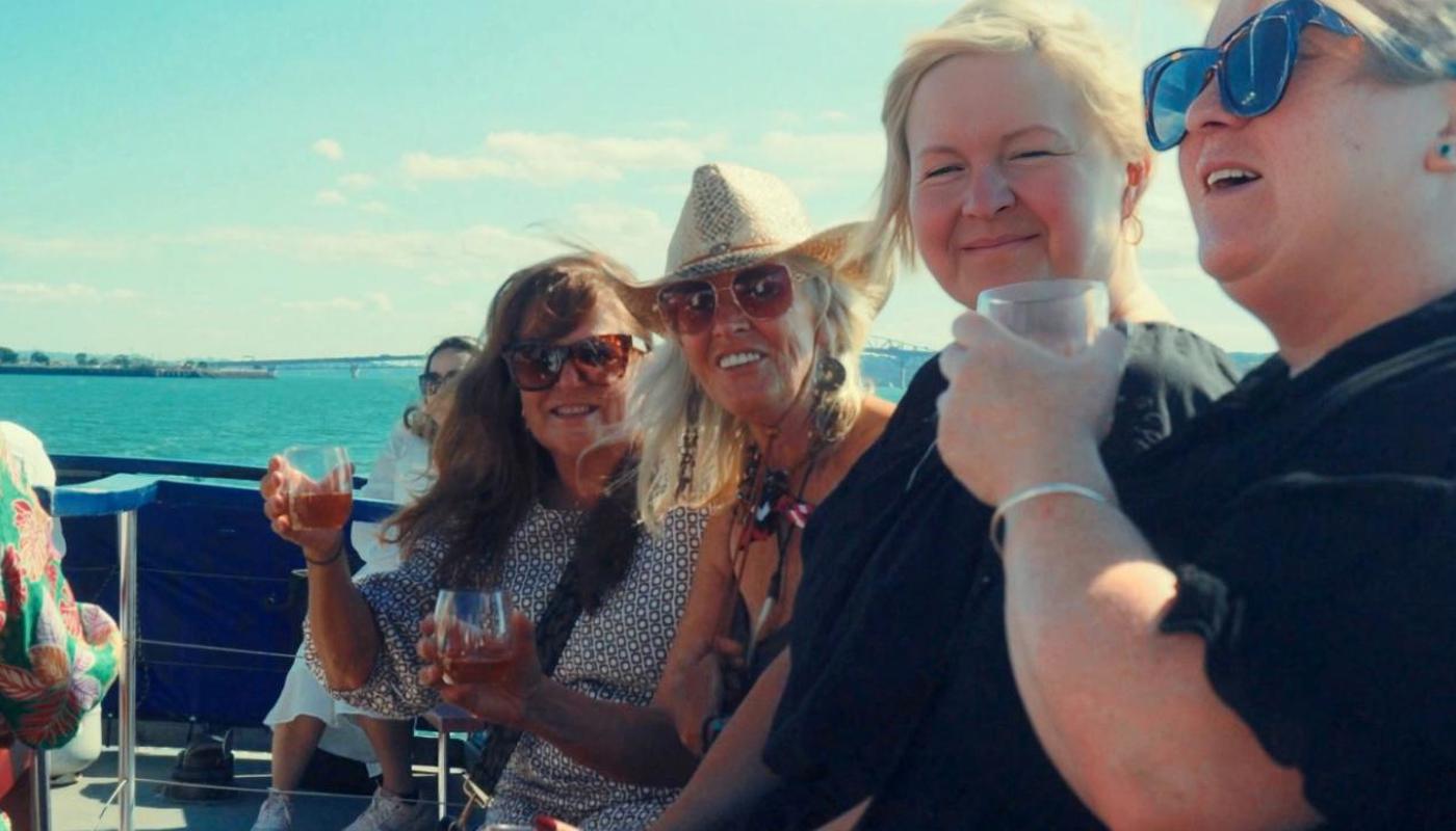 Guests enjoying a drink in the sea breeze on our Top Deck