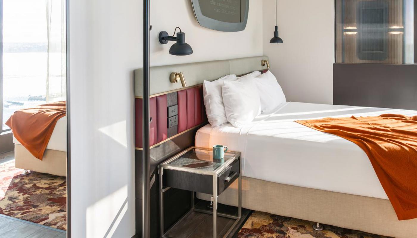 Our guest rooms blend heritage with sleek design that nods to the building's history.
