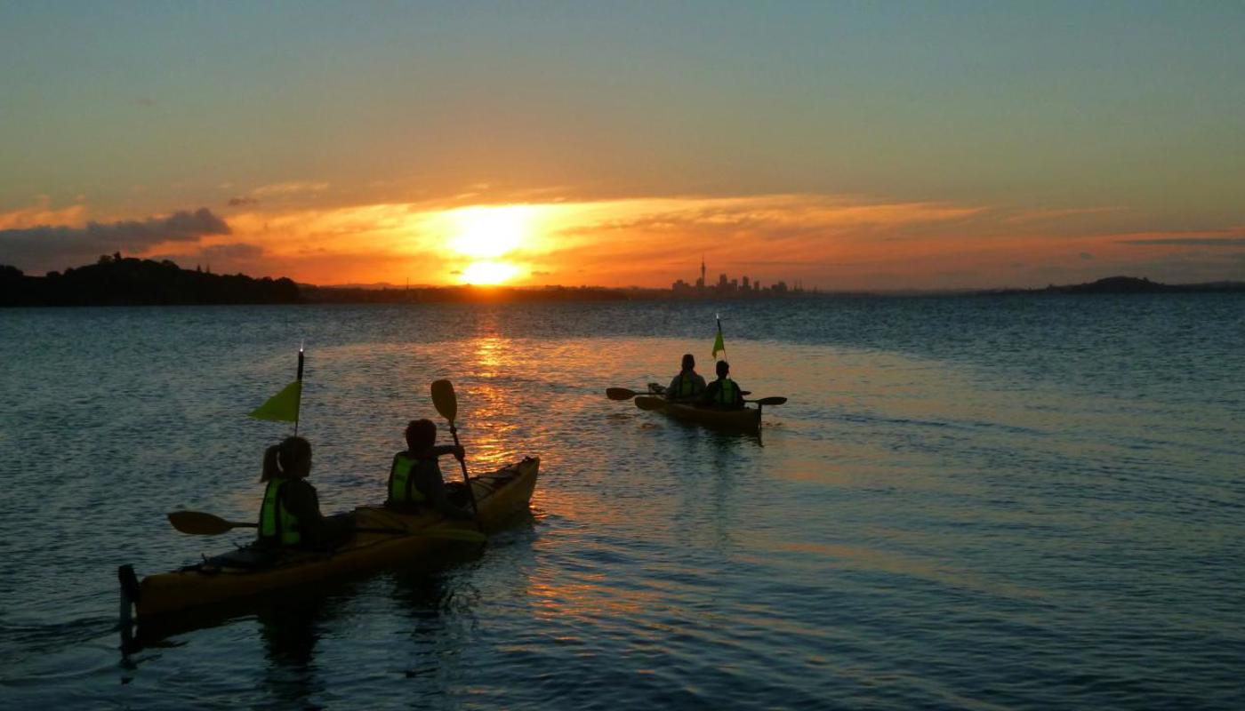 Kayaking back to Auckland City at sunset