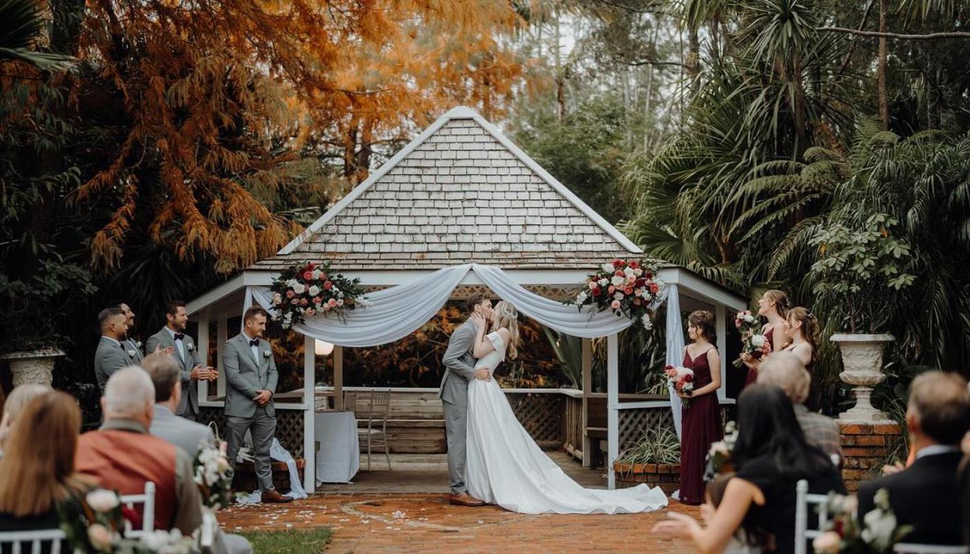 The Palm Isle Autumn wedding ceremony in Auckland wedding garden