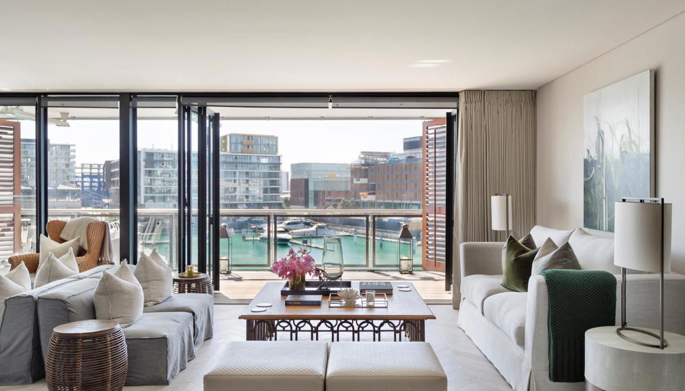 Open plan living room overlooking Viaduct Marina & Waitemata Harbour