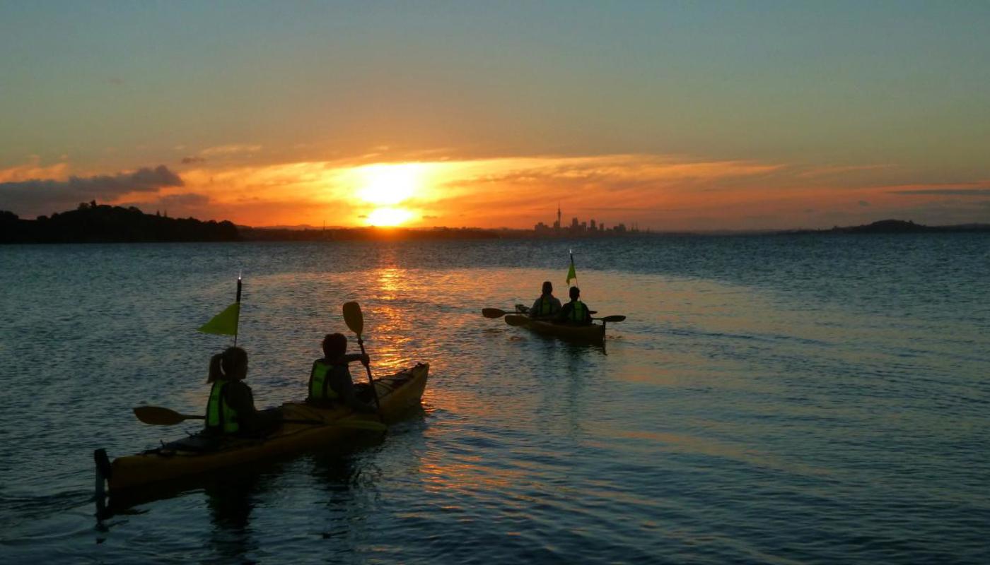 Paddling at sunset in the Hauraki Gulf Marine Park