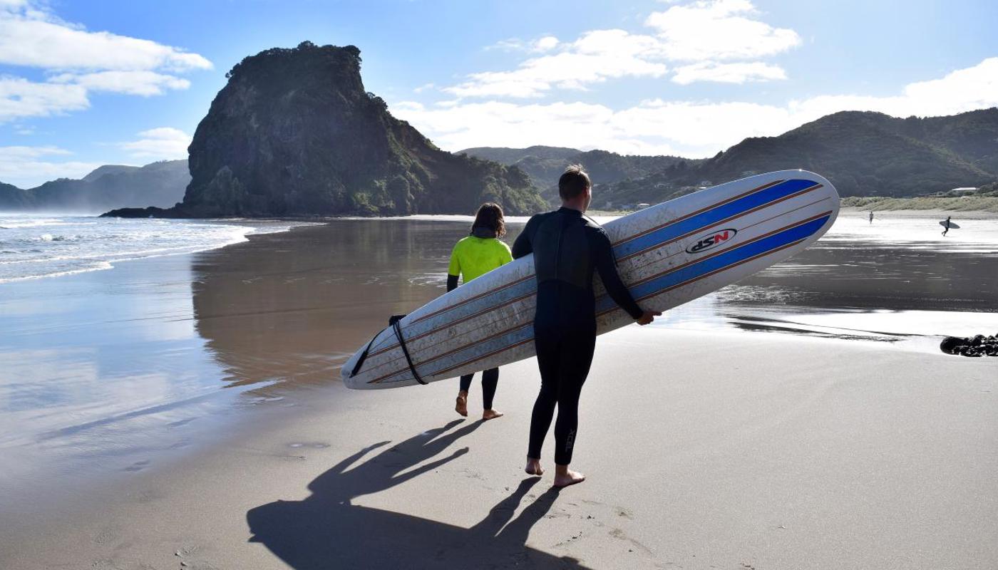 Surf coach and student