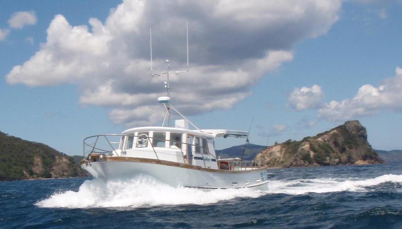 Sundancer underway near Whangaparapara