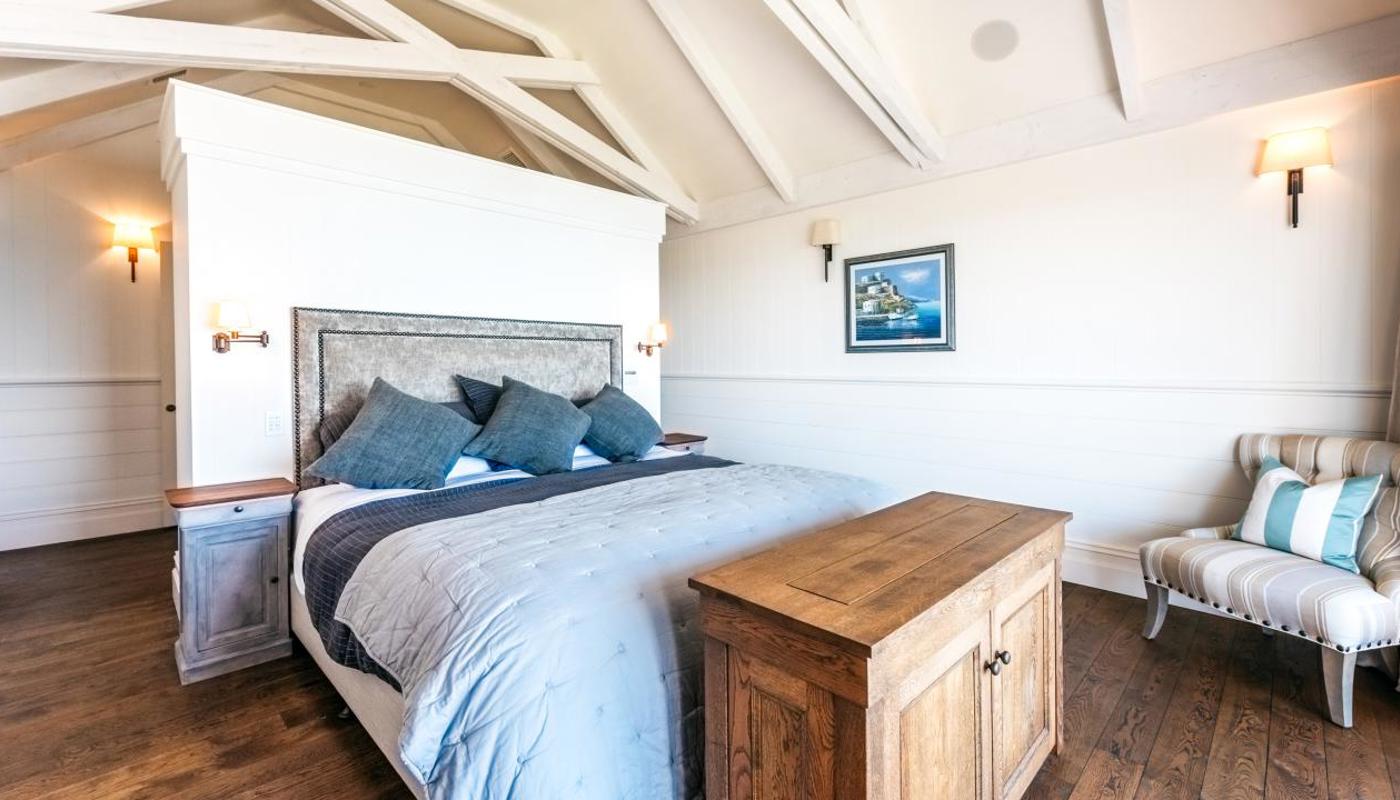 Master bedroom looking over the ocean - his & her en-suite bathrooms are either side.