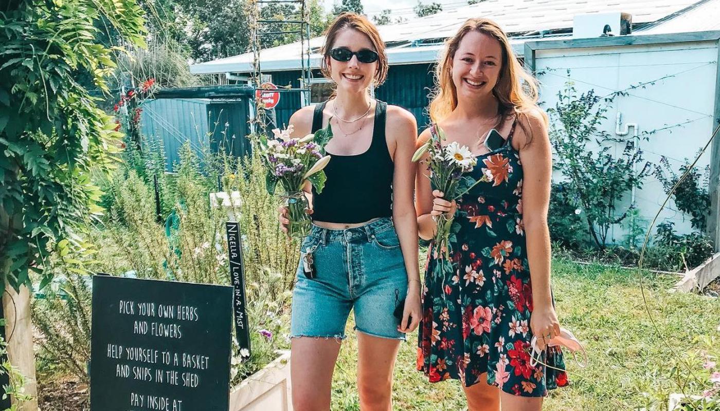 Happy girls with flowers picked at Slow Blooms.