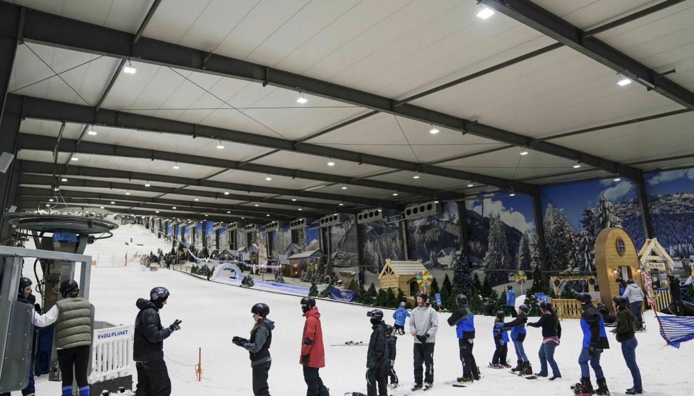 Skiers and snowboarders enjoying the slope