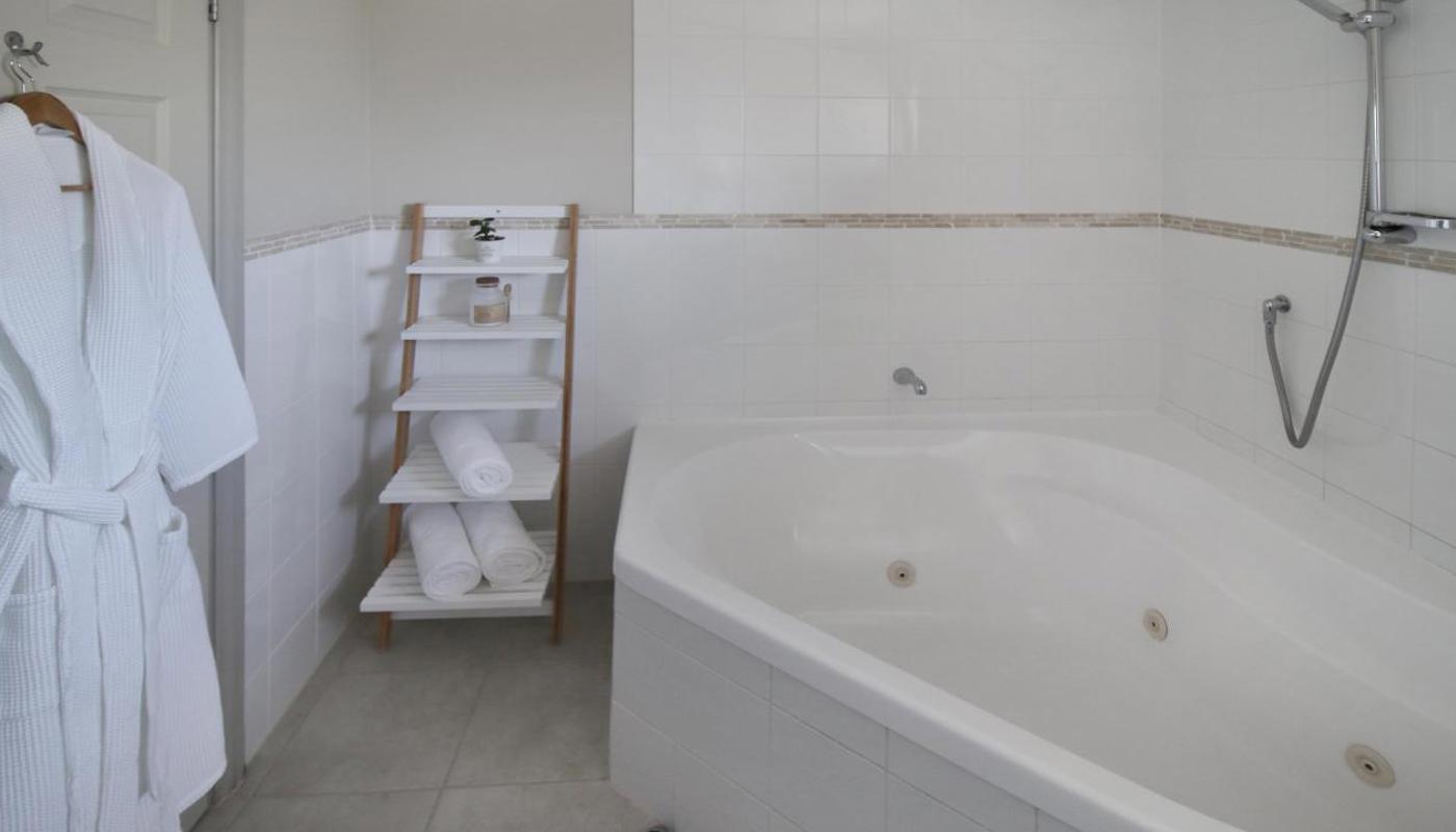 Spa bath studio, executive suite and family suite bathroom with luxurious 2 person spa bath.