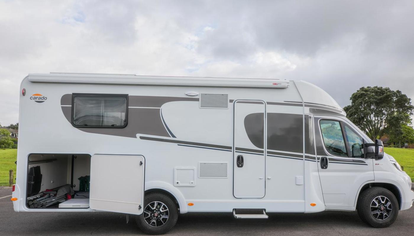 Luxury motorhomes with outdoor awnings and massive outdoor storage capacity.