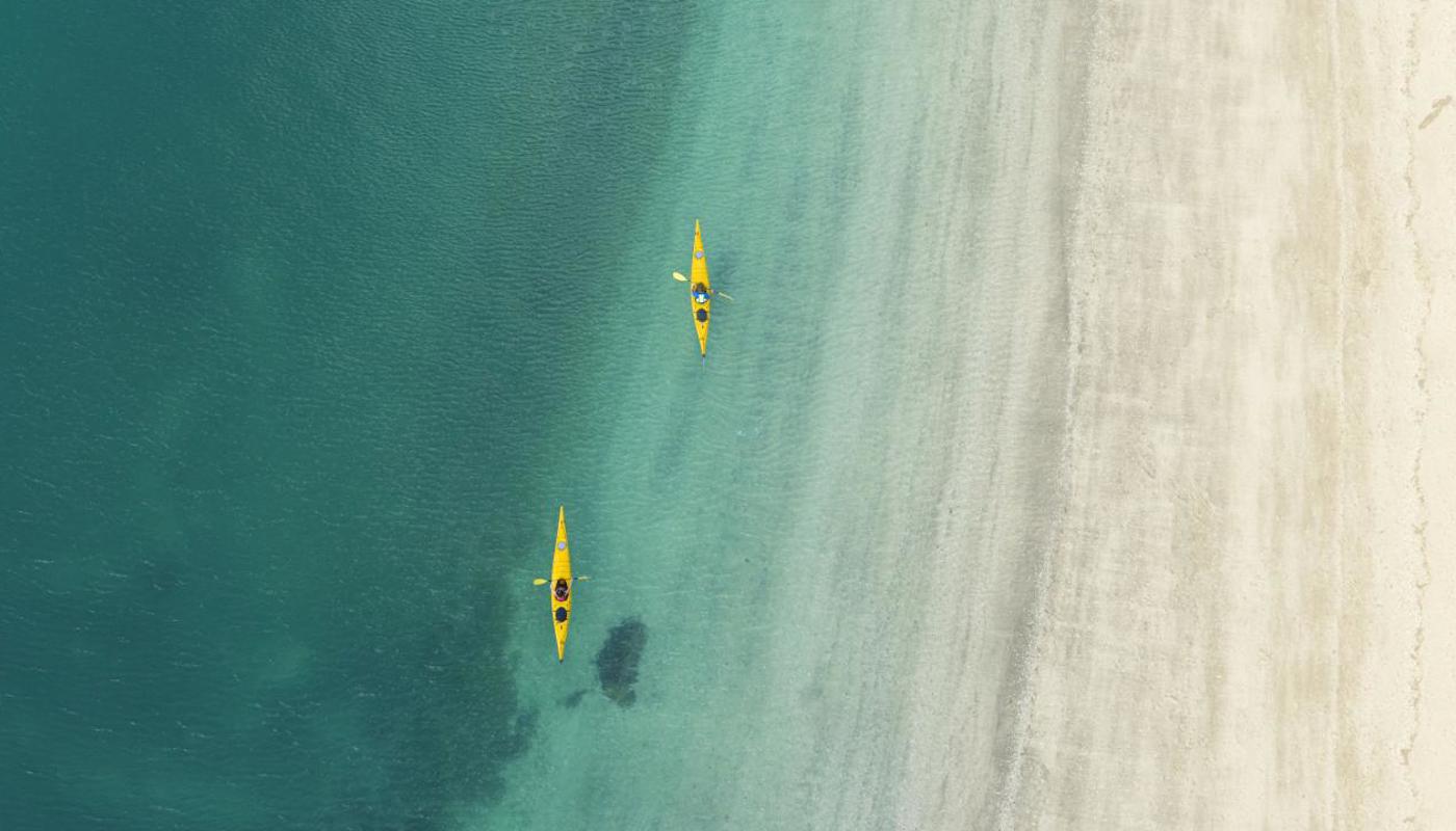 Paddling the tranquil waters of Motuihe Island