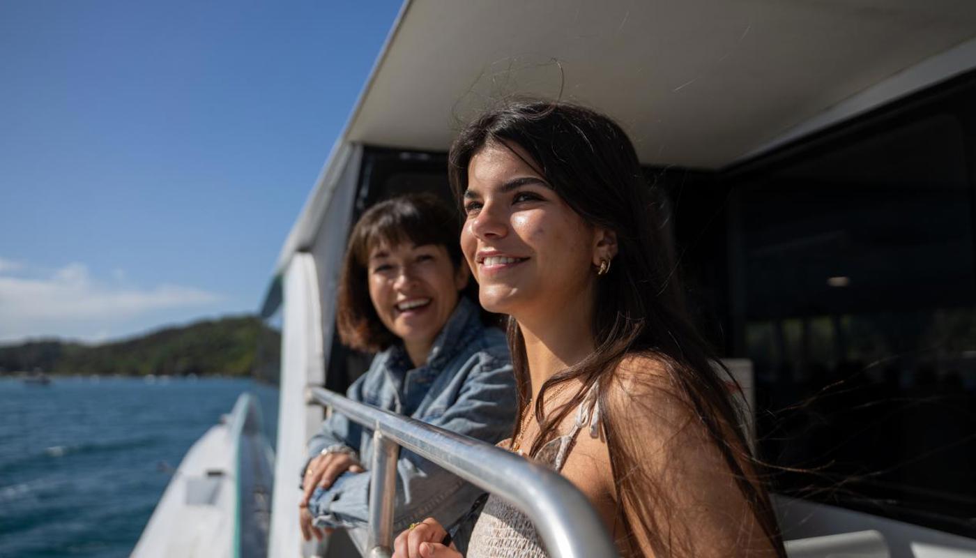 Mother and daughter enjoying the view on their way to Waiheke Island on a Fullers360 ferry