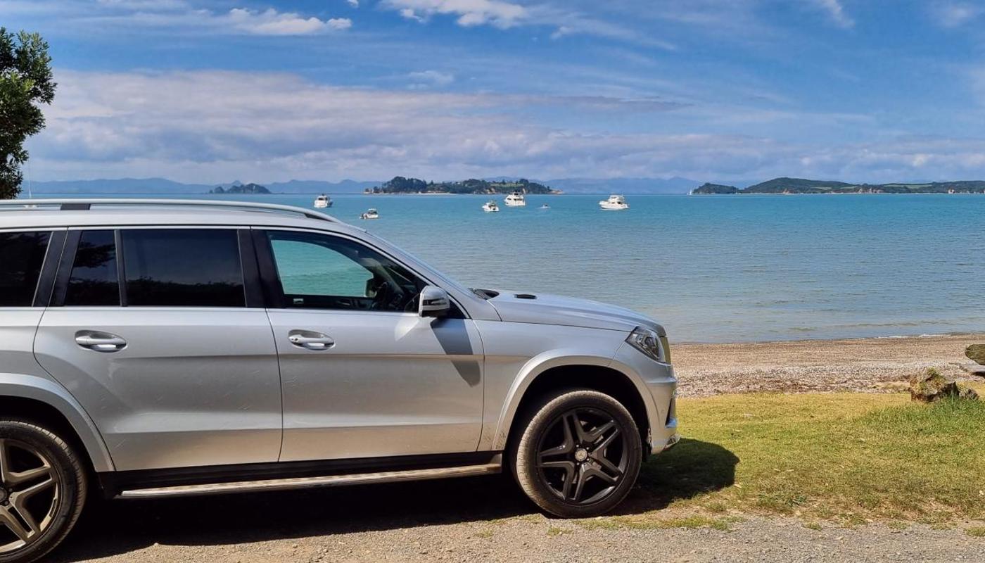 Our luxurious 4WD SUV meets the unsealed roads of Man O' War Bay.