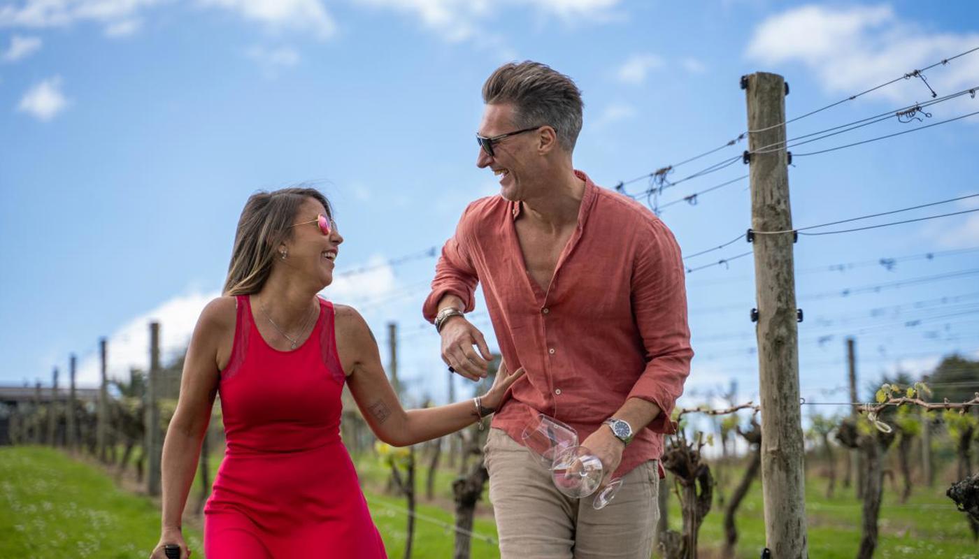 A couple having fun while visiting a winery on Waiheke Island